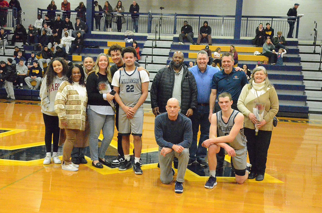 Seniors Corby Bennett and Garrett Watkins and their families were honored on Senior night