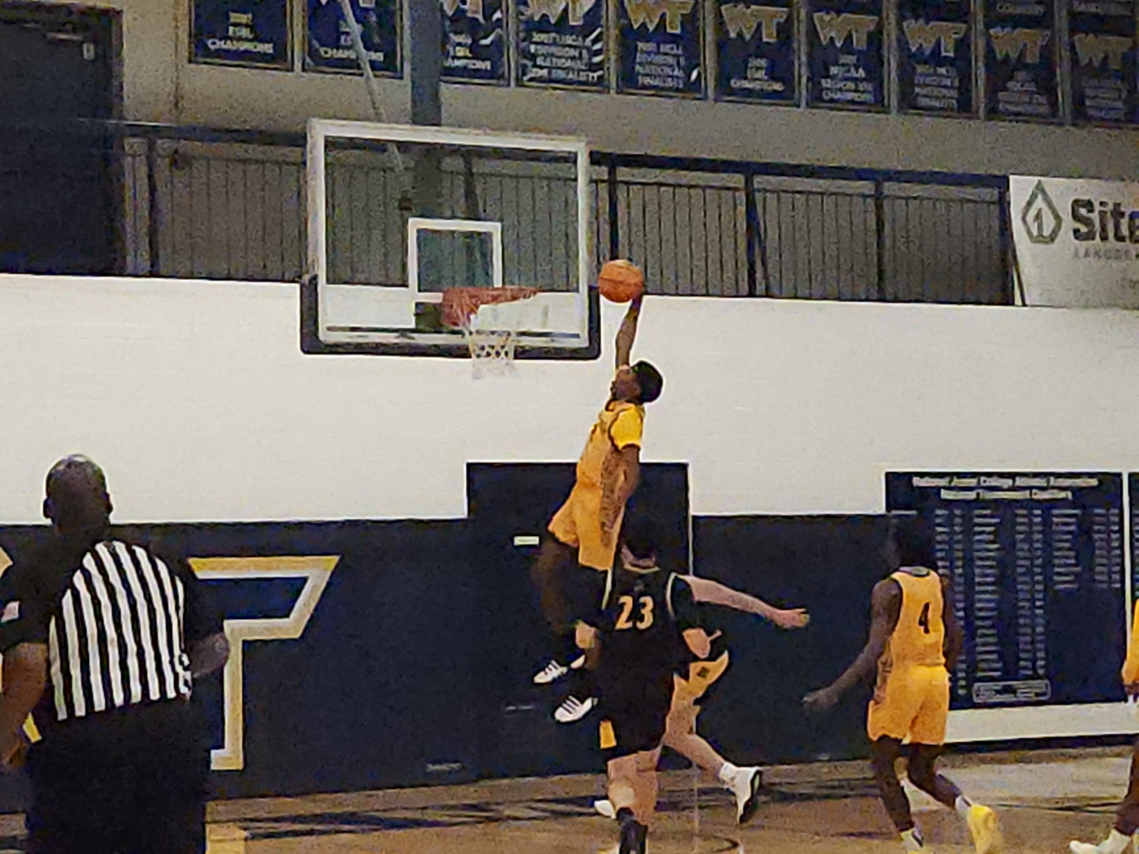 Freshman A'Jaad White slams home two of his 13 points in Williamson's 72-58 win over SUNY-ESF